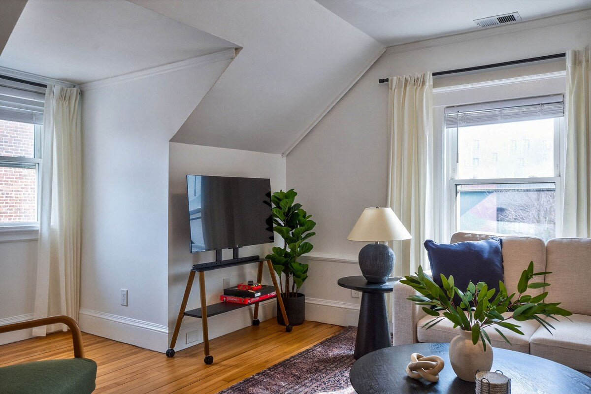 Quiet Elegance Nest — living room with mounted TV
